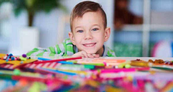 portrait-of-happy-preschooler-with-big-smile-on-FMUJA2X-1.jpg